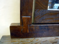 Butterfly-key joinery at mirror support.